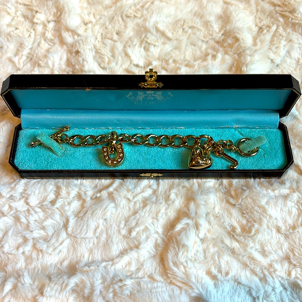 Juicy Couture bracelet in original box with 3 charms. MINT CONDITION
